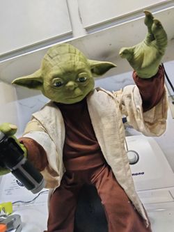 Animatronic Yoda with lifesaver and wand