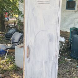 A metal locker it’s 75 inches tall 18 inches wide and 24 inches deep