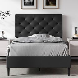 Twin Faux Leather Bed Frame with Headboard, Black
Upholstered platform bed with wooden slat support, no box spring needed.