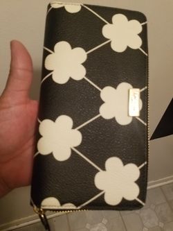 New wallet by Kate spade tag waa 175 yes its available