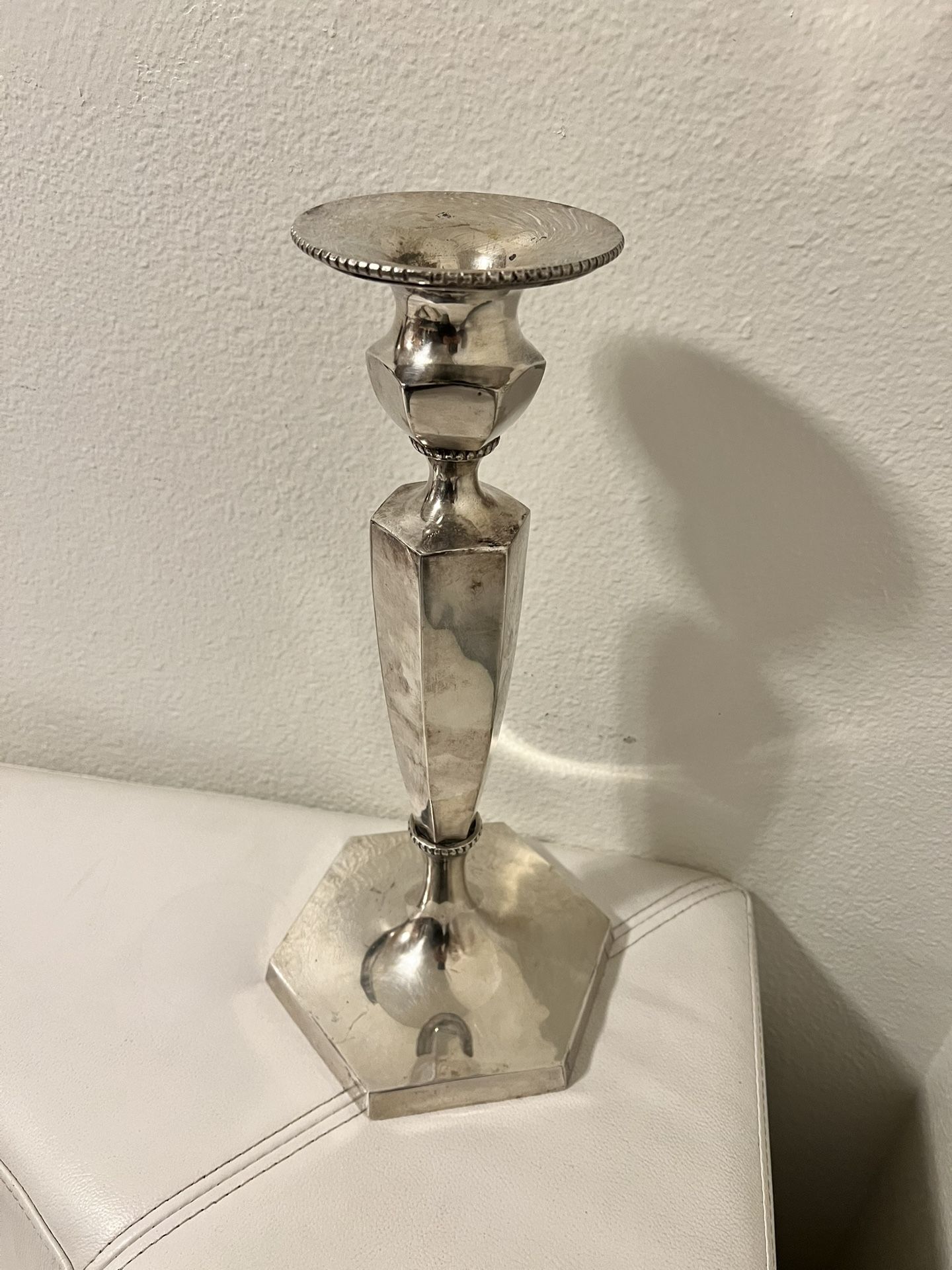 silver plated candle holder, very heavy and beautiful.height 15 inches