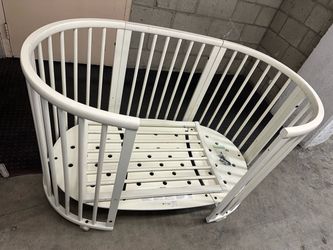 White Oval Baby Crib