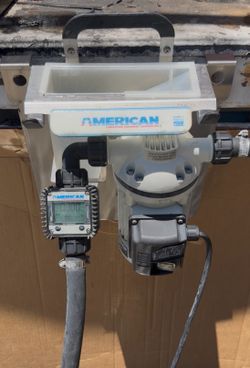 American DEF/antifreeze pump set up for tote with dispensing nozzle