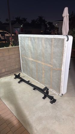 Queen size box spring and bed frame.