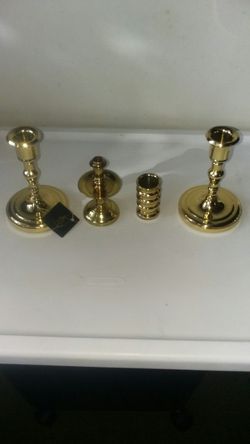 (LOT OF 4) HEAVY BRASS CANDLE HOLDER'S. ASKING $35