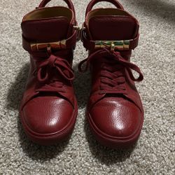 red Buscemi 100MM high-top leather sneakers with gold-plated hardware. 