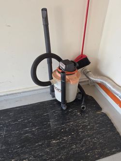 RIDGID Wet/Dry Shop Vacuum with a 3.25 peak HP motor and an 8-gallon brown canister 
Works awesome! It really sucks!  Ha ha!
