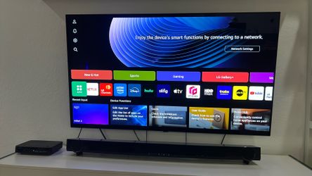 large LG TV  with Yamaha speaker bar