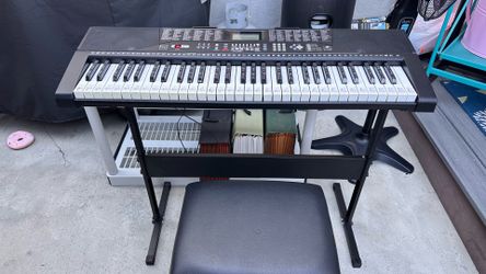 Electric keyboard with stand and seat