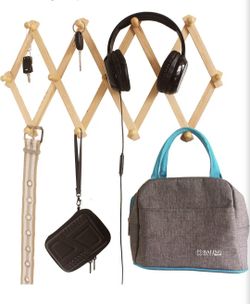 Accordion style expanding wall rack