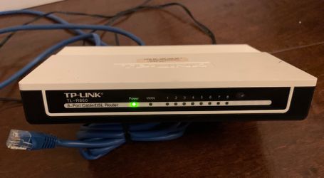 TP-Link 8 port Network Router. Includes 4 cat5 cables