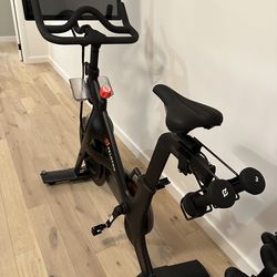 Peloton bike and shoes