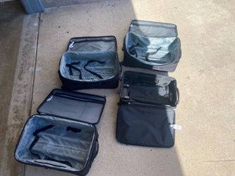 3 Medium sized suitcases. 1 Small