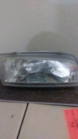 96 Mitsubishi mirage Passenger front headlight