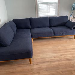 Navy blue cloth mid-century modern sofa. 