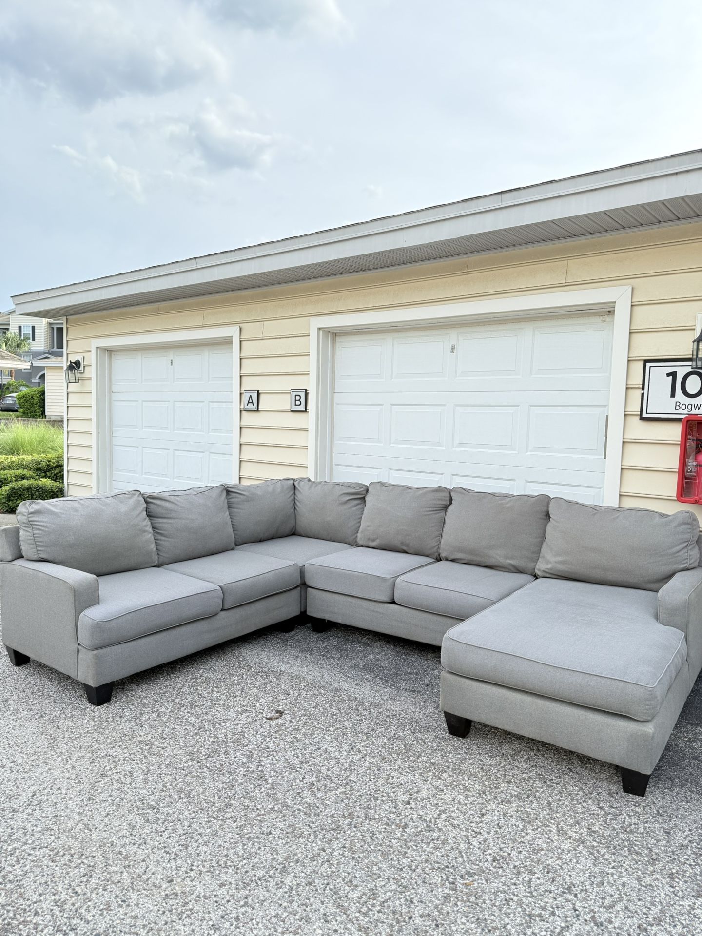Modern gray sectional couch, recently cleaned and in good condition