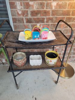 Old tray cart with Ceramic pots and a tray with small plastic pots