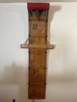 vintage wooden toboggan / snow sled modified as a rustic wall hanging