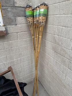 three tiki torches
