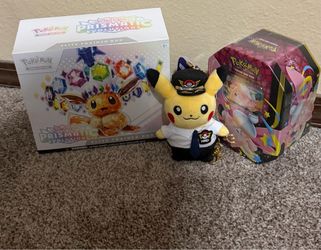 Prismatic ETB and another Pokemon tin (Pikachu not for sell)