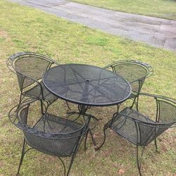 Wrought Iron table with four Arm Chairs