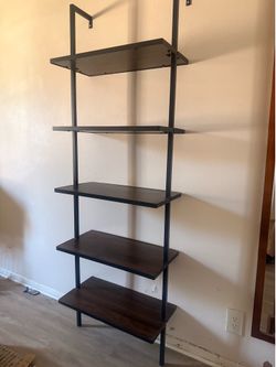 Selling two five tier ladder wall shelves.