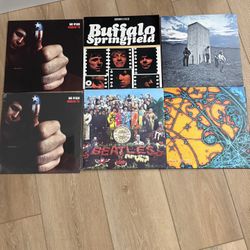 Audio Technica turntable with speakers and a set of vinyls