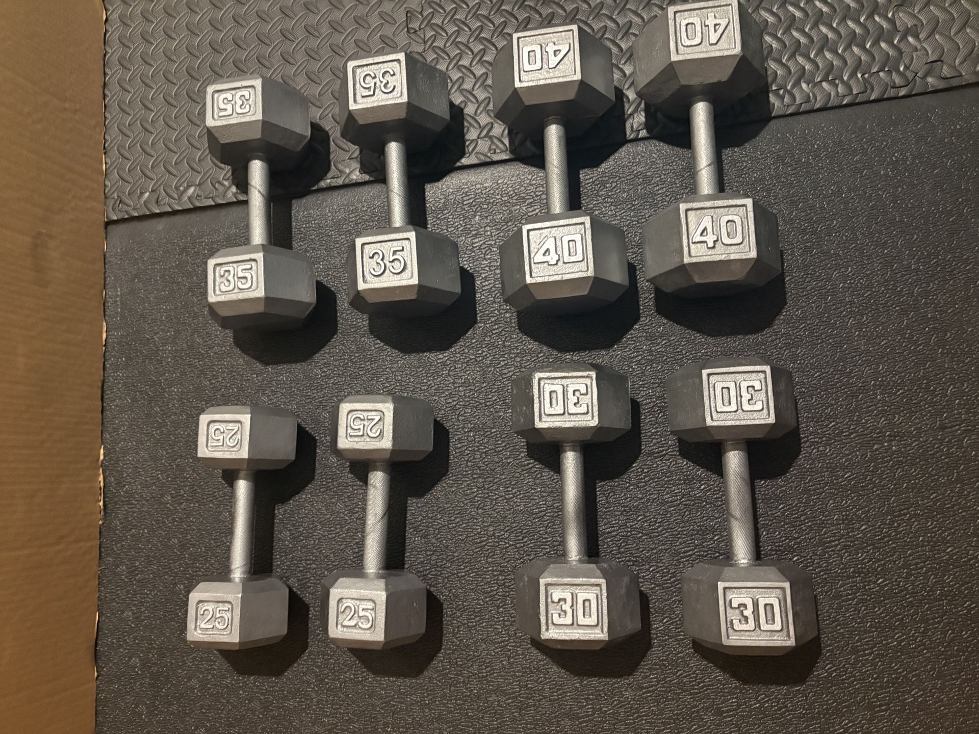 Set of Hex Cast Iron Dumbbells ( heavy) 40#, 35#, 30 and 25 # In total: 260 pounds.