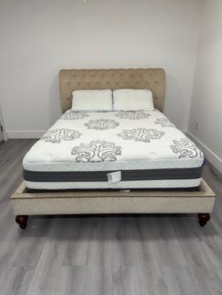 Beautiful beige upholstered Queen size bed frame, mattress and boxspring included for free. Delivery available for an additional cost.