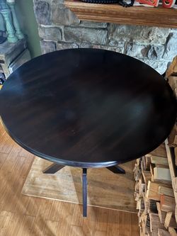 Oak Bar Table Width 35 inches and height 39 inches.