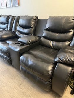 Black leather recliner couch w/ cup holders