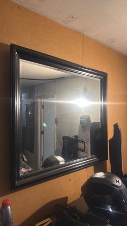 Black dresser and black mirror