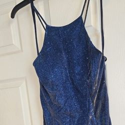 This is a blue glittery evening or cocktail dress with a cutout back