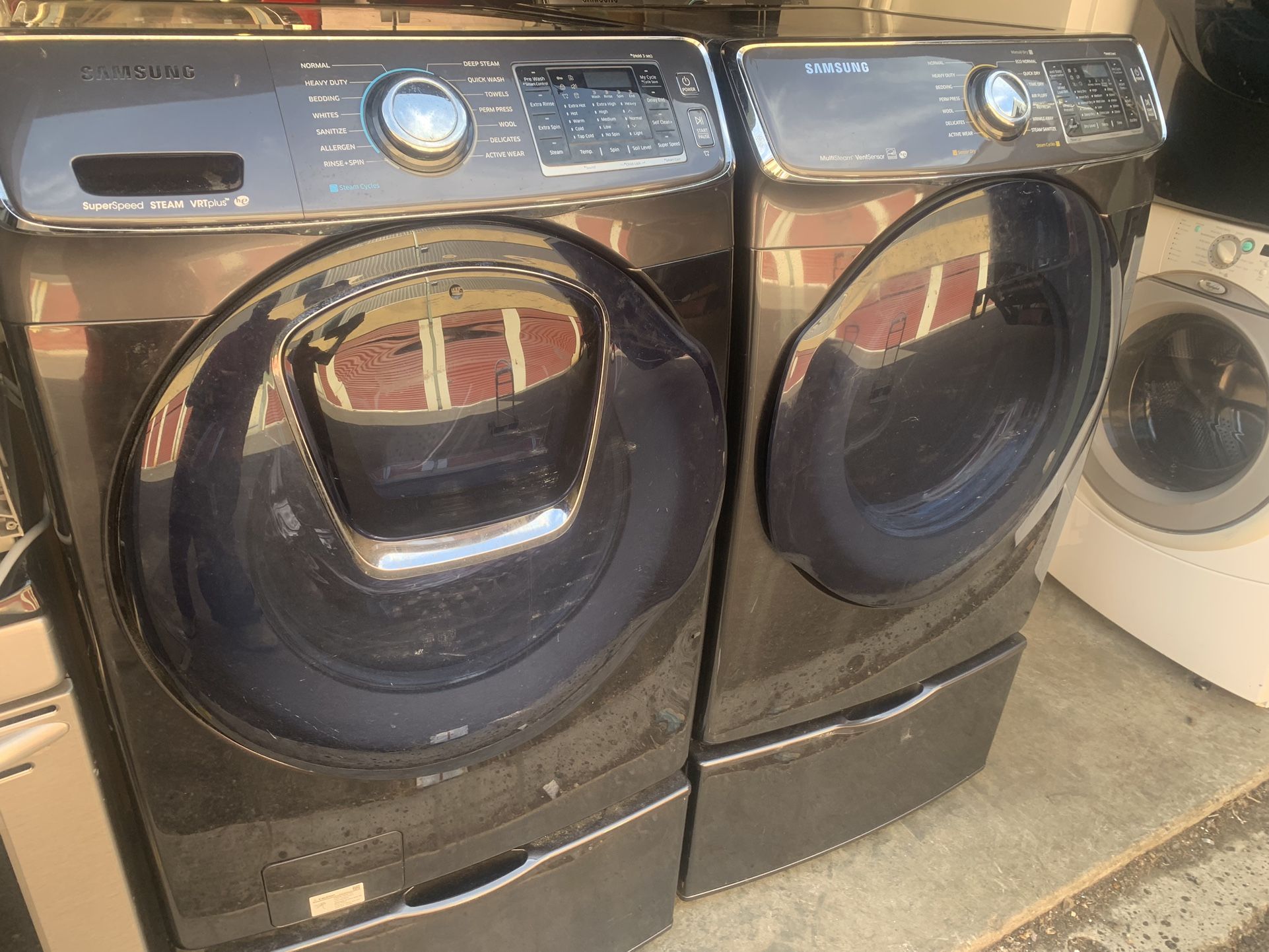 XL Samsung Stainless Steel Washer And Electric Dryer On Pedestals