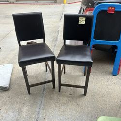 2 brown chairs 40”h. Seat to foior 24” seat approx 16x16