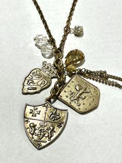 Medieval shield coat of arms lions cross fleur de lis heraldry gems charms gold metal chain necklace jewelry