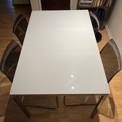 Dinner Table along 4 dinner chairs 