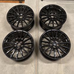 Subaru STI Stock Wheels a set of 4/gloss black 18” 