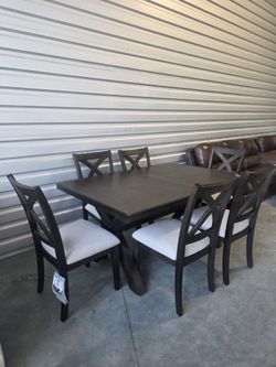 New Costco Westen Dining Table and 6 Chairs

Constructed of Rubberwood and Poplar Solids with Oak Veneers
Self-Storing 18” Leaf
Light Gray Fabric Upho