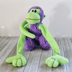 8" Giant Hands Purple Neon Green Monkey Chimpanzee Plushie Stuffed Animal with Long Floppy Arms and Curled Tail. Circa Y2K. Pre-owned in excellent con