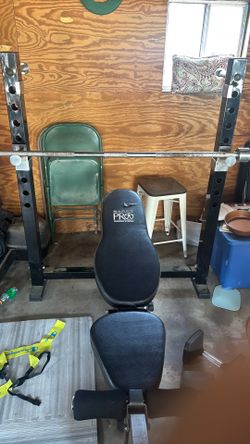 Adjustable Marcy pro weight bench with Olympic bar