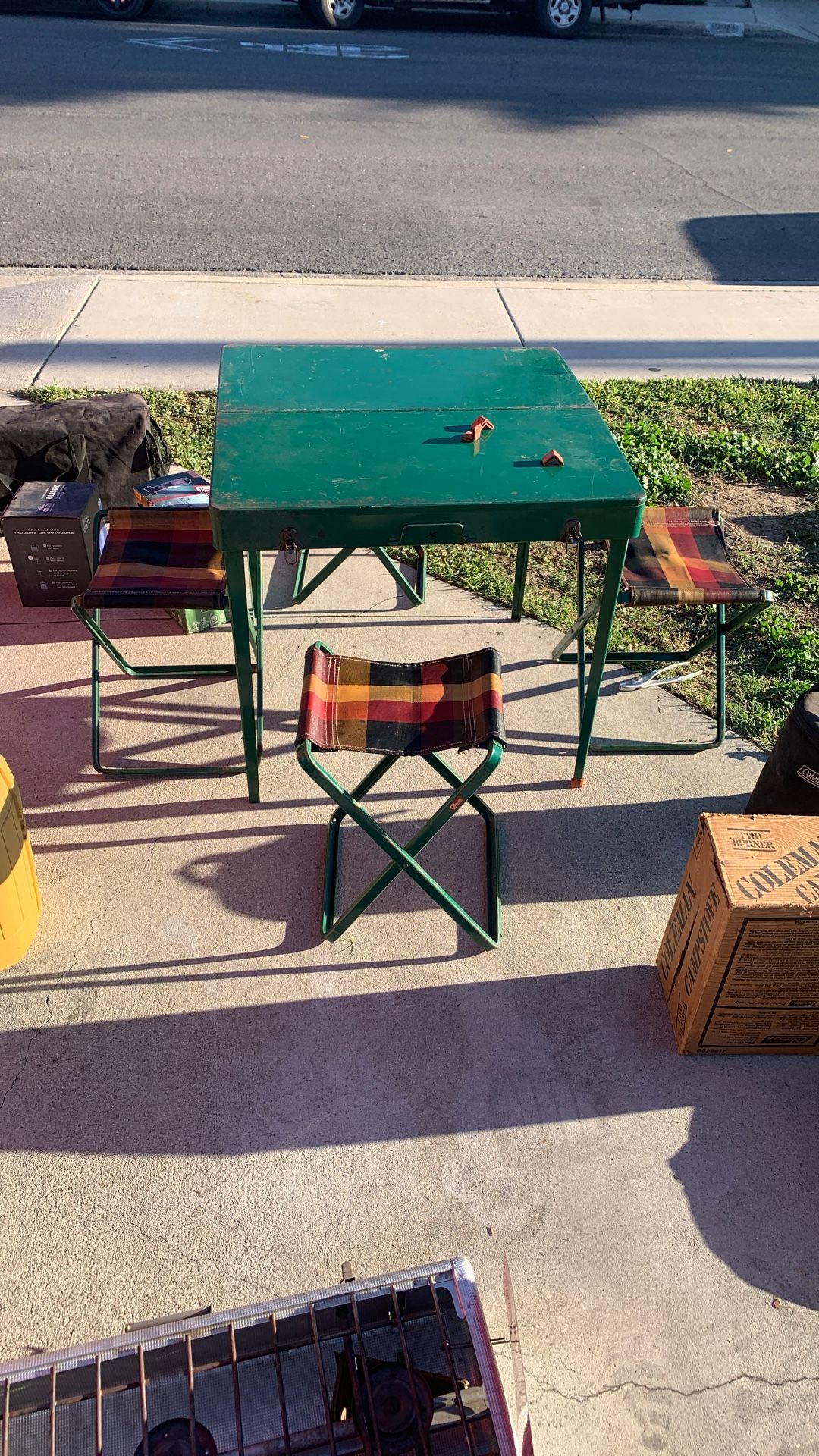 Old vintage Coleman camping table with stools