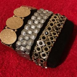 3 Wide Stretch Band Bracelets..Gold,Silver,and Gold & Black