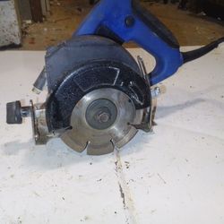 tile/Wood Cutter Machine. It is a power tool designed for cutting tiles and wood. 