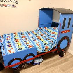 Boy’s blue metal train bed twin bed