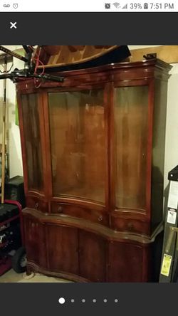 Antique curved front China cabinet. 