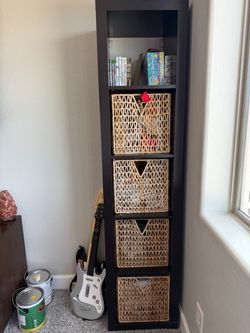 Tall Brown Shelving Unit with Wicker Baskets