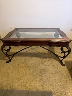 Wood and glass coffee table with wrought iron base