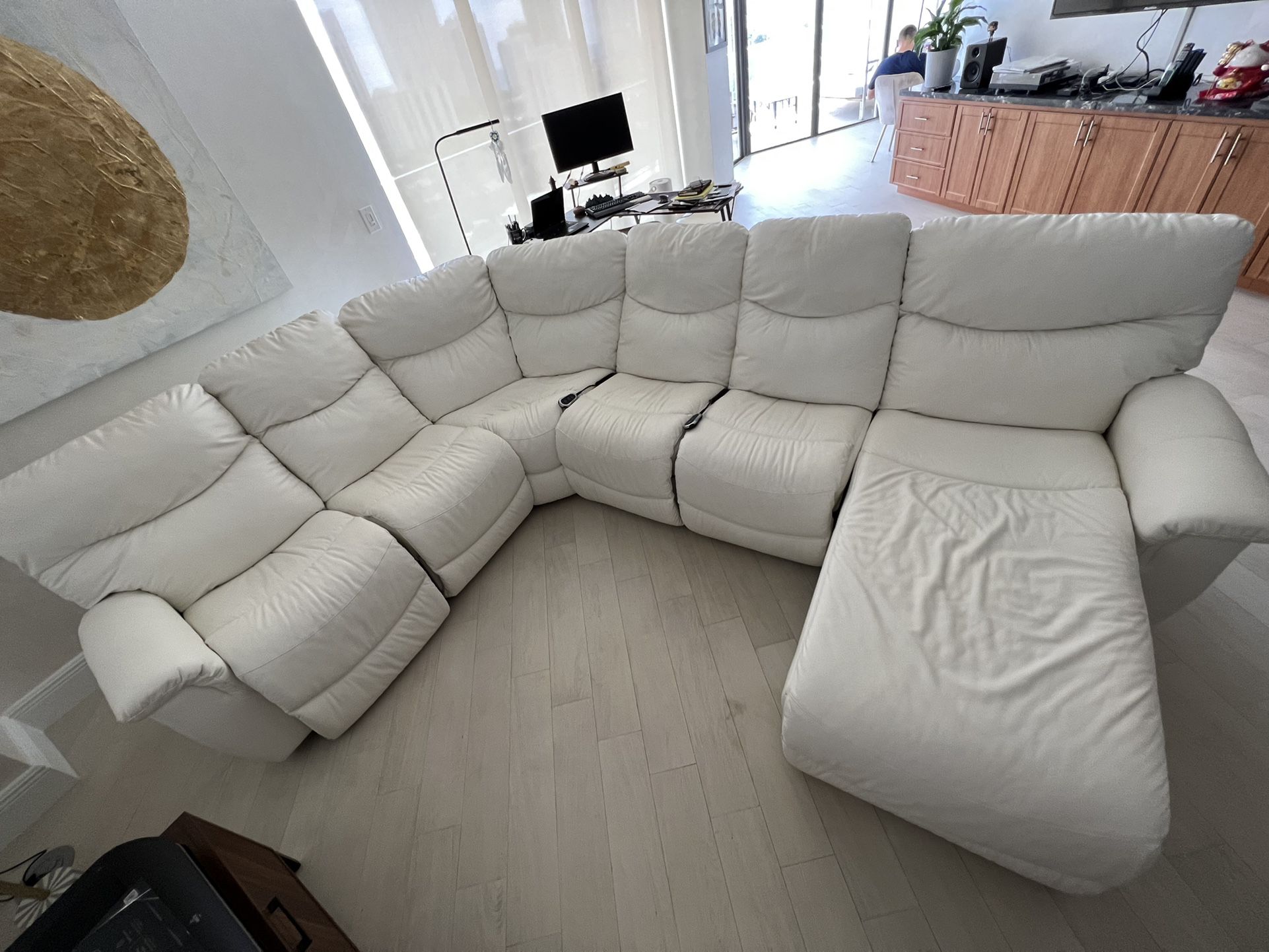 White leather sofa. Motorized