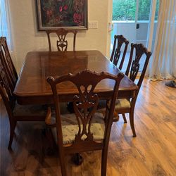 Dining table with two armchairs, and four chairs